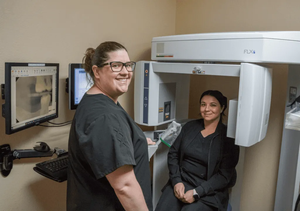 Dentist aiding a patient with ear pain