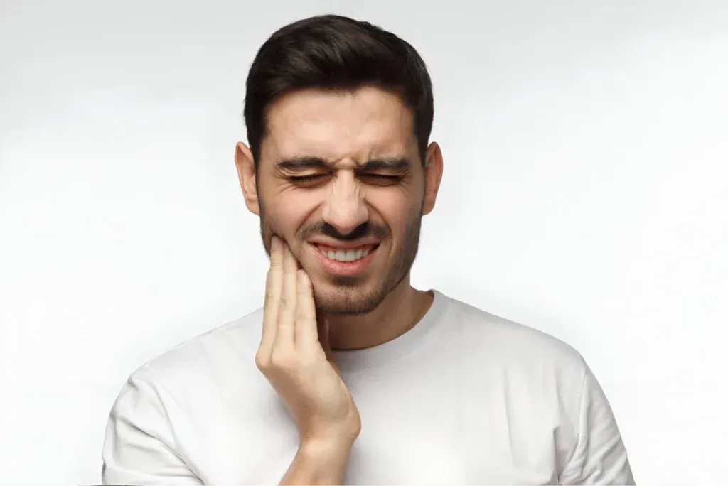 Man holding his jaw in pain