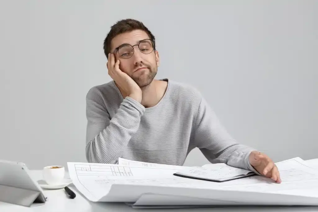 Man with TMJ applying too much pressure to his jaw.