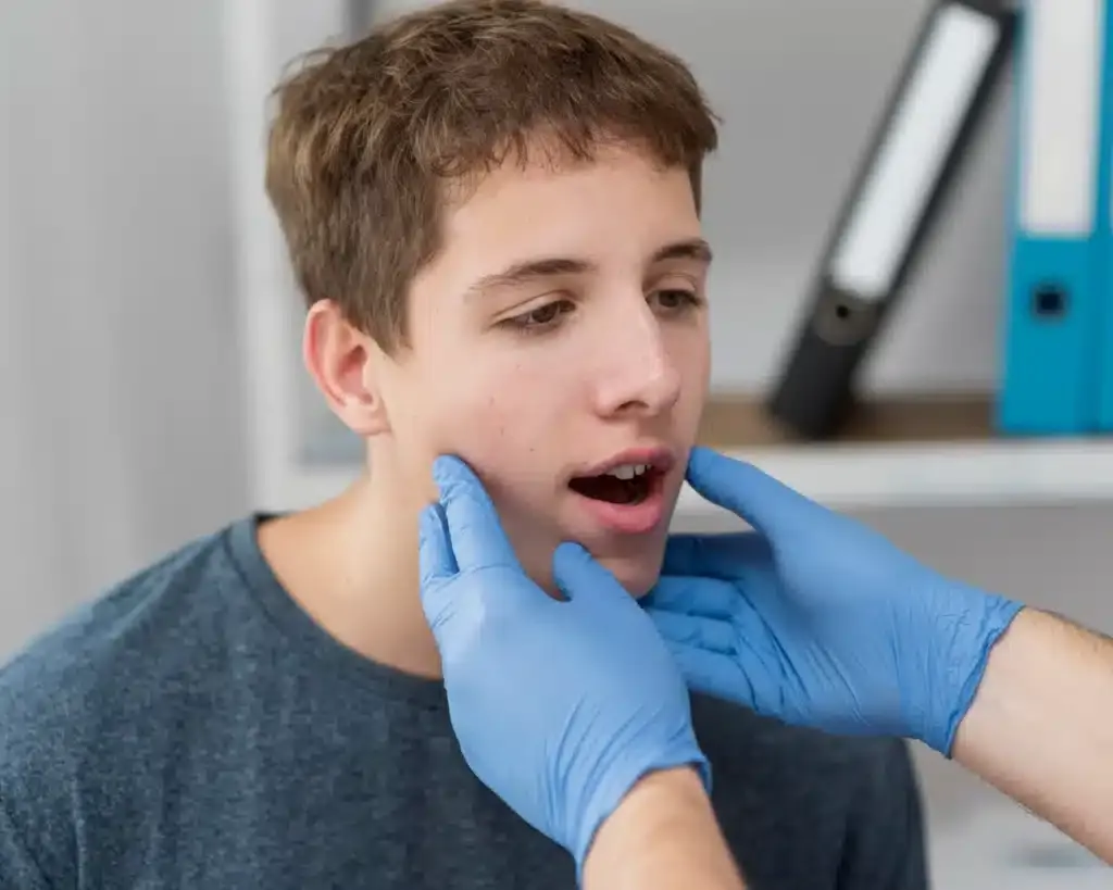 Boy having TMJ treatment.