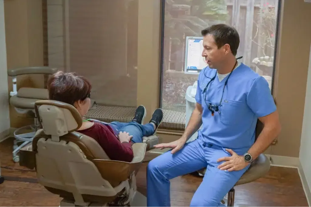 Dentist talking to a patient