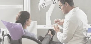 image of a dental office and a women receiving a treatment in dental hospital
