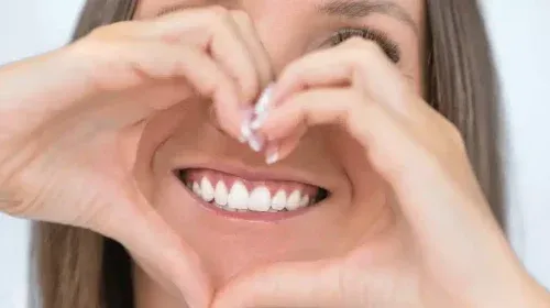 Tips For Optimal Oral Hygiene 1 Image of a women that is showing her white teeth