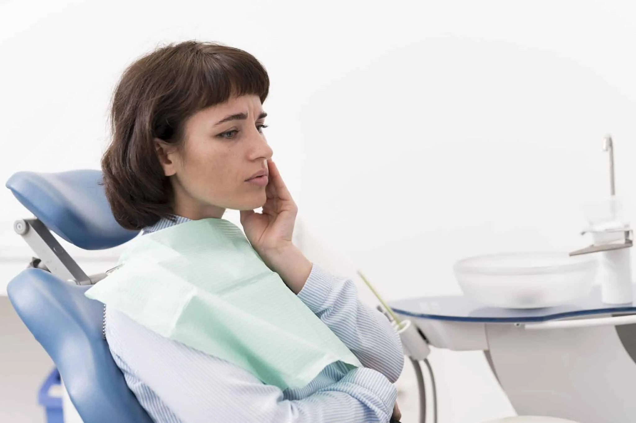 female patient having toothache dentist-s office