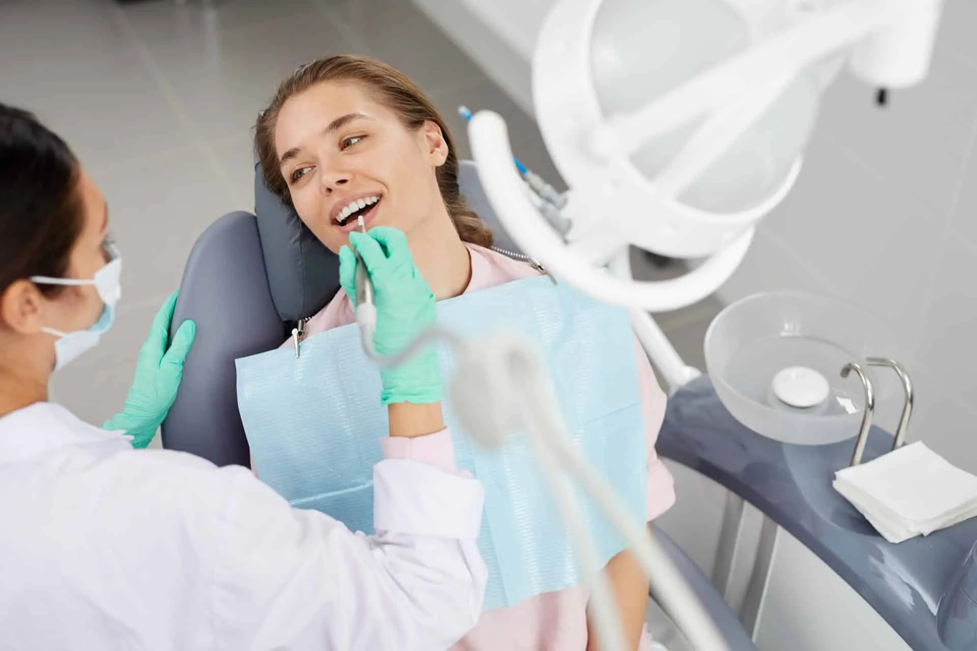 Young woman receiving a gentle dental exam